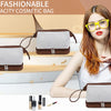 A woman models an elegant brown PU leather cosmetic bag with a light gray interior and gold hardware.