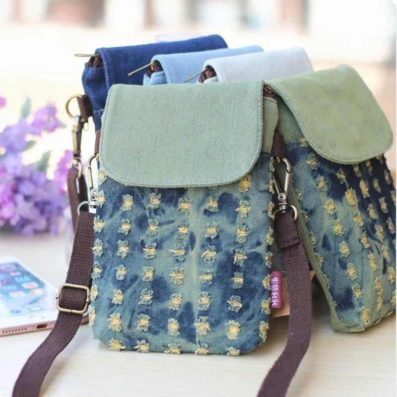 A denim mini messenger bag with triple-layer storage featuring blue fabric and olive green accents.