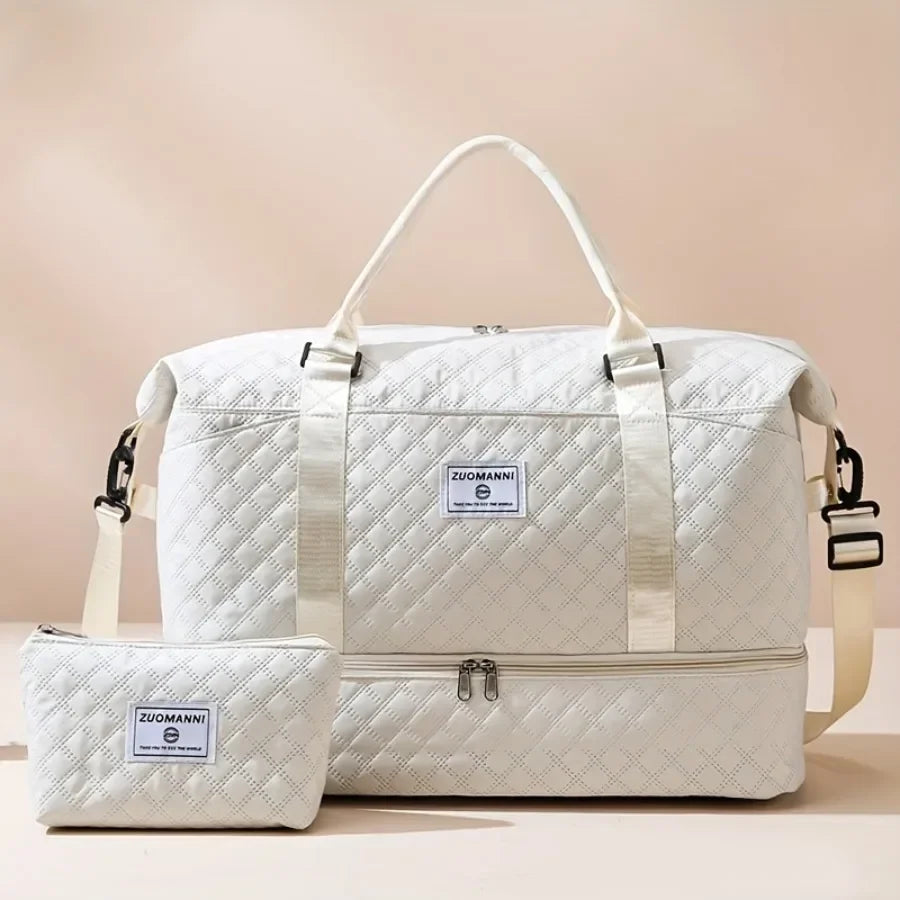 A white duffel bag with a handle and an attached cosmetic pouch is shown against a light background.
