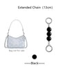 Silver extended chain with black beads and a circular charm for bag decoration