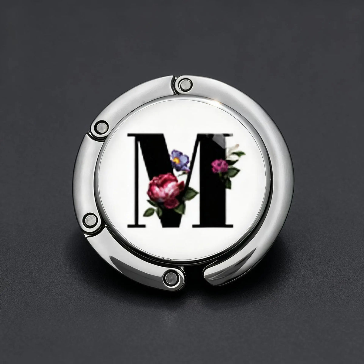 Silver foldable letter hanger hook with the letter M engraved and decorated with small flowers
