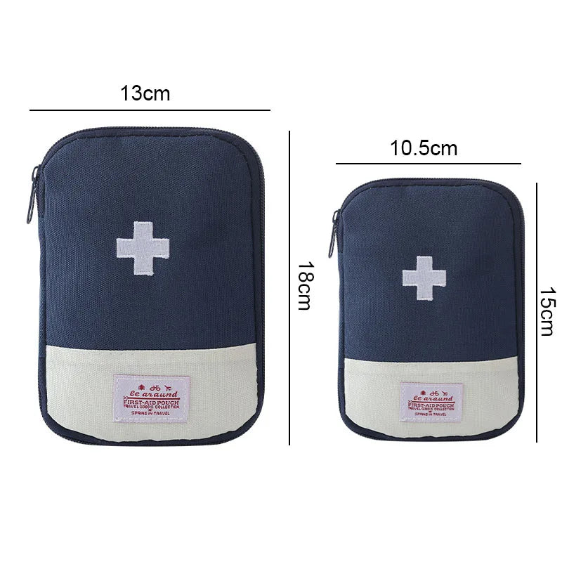 Navy blue portable first aid kit storage bag with a white cross and pink label