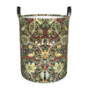 A vintage floral laundry hamper with a dark green and gold pattern, featuring red accents.