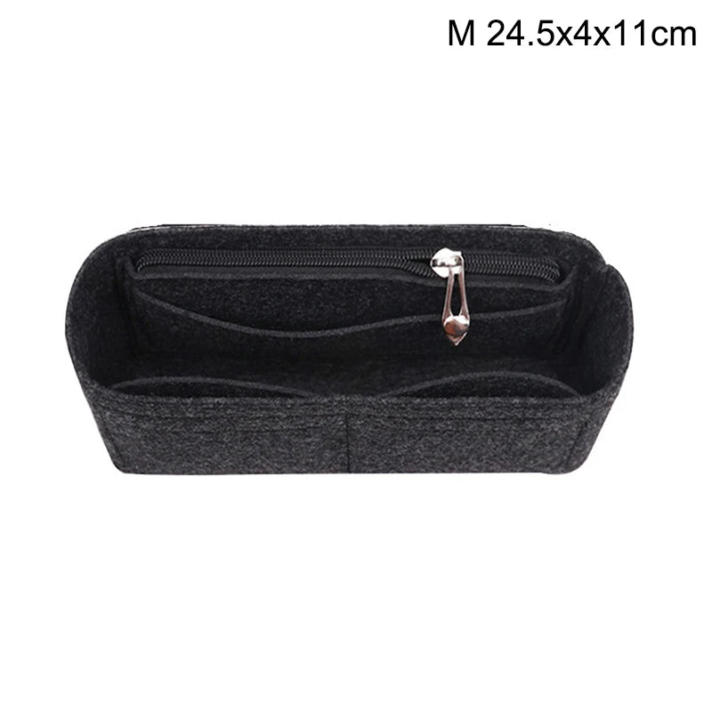 Black felt bag insert organizer with a zipper and a small charm