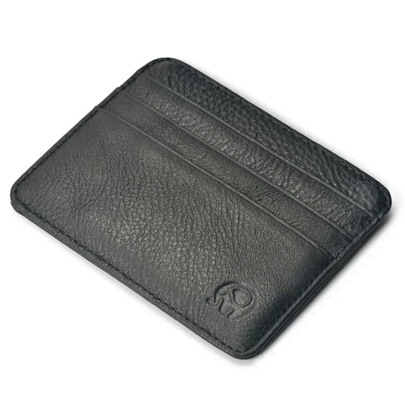 A black genuine leather slim card holder wallet shown from above.