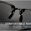 Black rimless polarized sports sunglasses with comfortable nose pads shown against a dark background