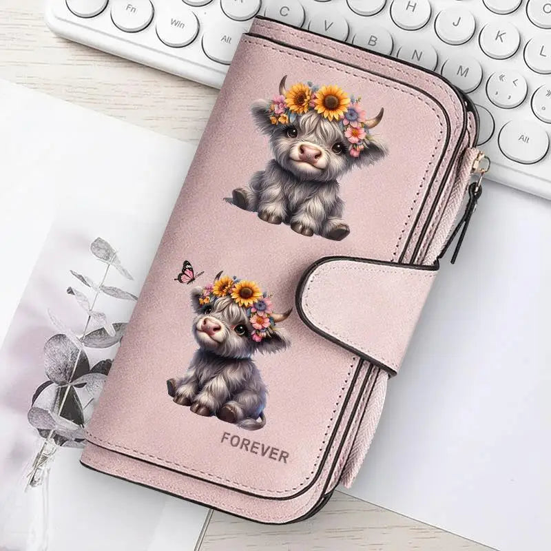 A pink zippered wallet featuring a cute puppy with flowers, placed next to a laptop keyboard.
