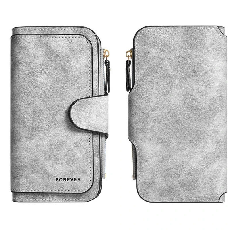 A light gray leather zip wallet with a rounded edge and the word FOREVER embossed on it.