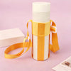 A white water bottle is secured in an orange fabric sling bag with a strap.