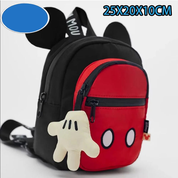 A black backpack featuring a red panel and a white hand design, resembling a plush cartoon mouse duck.