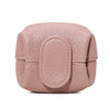 A round, pink faux leather coin purse with a snap closure and textured finish.
