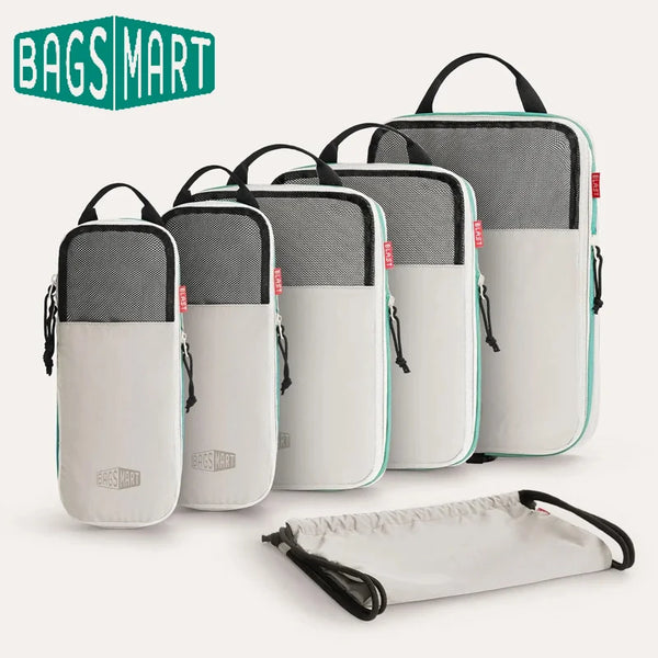 A set of six gray and white expandable compression packing cubes displayed on a white background.