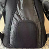 Black fashion backpack with a textured front panel and black lining.