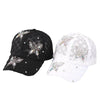 A pair of summer floral mesh snapback baseball caps in black and white.