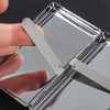 A hand opens a premium metal cigarette holder, showing the silver metal design.