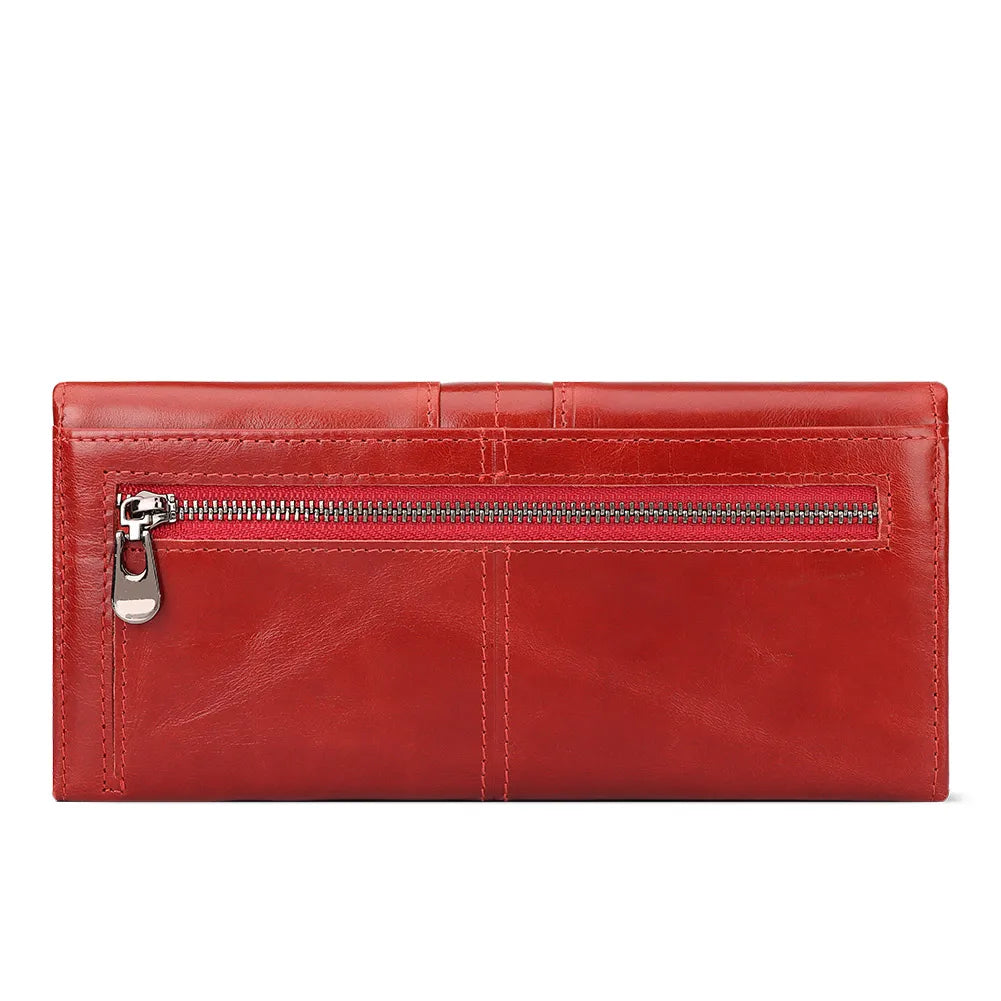 A red genuine leather clutch wallet with a silver zipper and stitched lines.