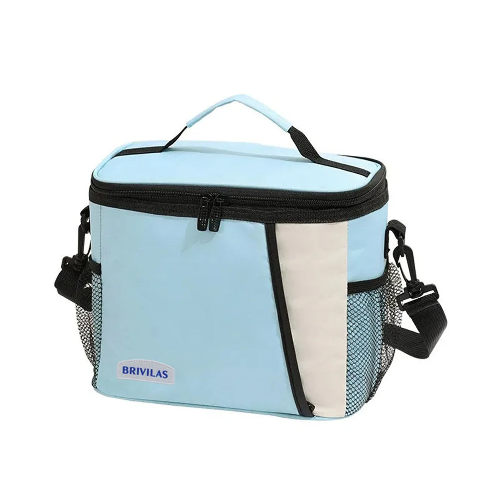 Light blue insulated reusable lunch bag with a black zipper and mesh pocket