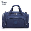 Navy blue durable nylon travel duffle bag with zippered compartments and handles