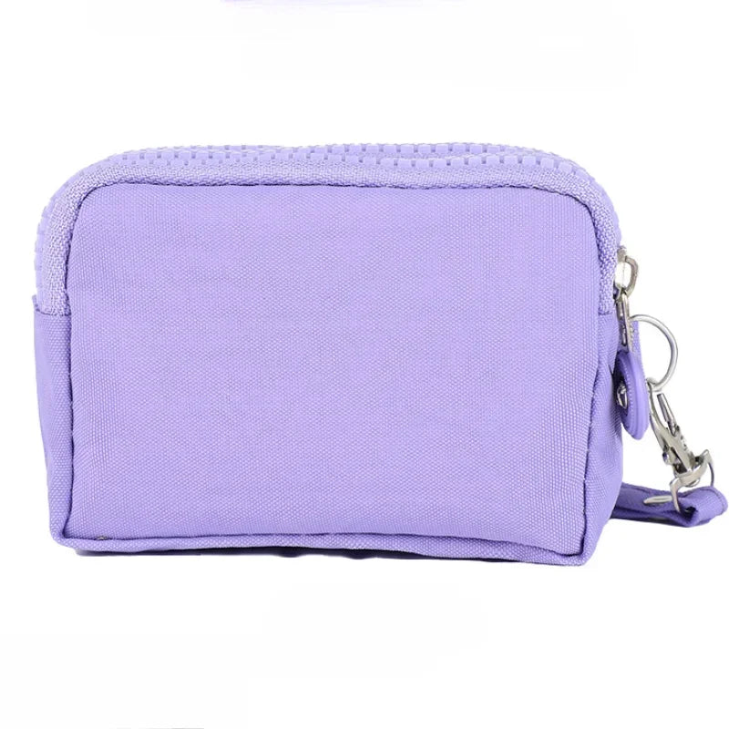 A lavender compact three-layer nylon zipper pouch with a drawstring closure.