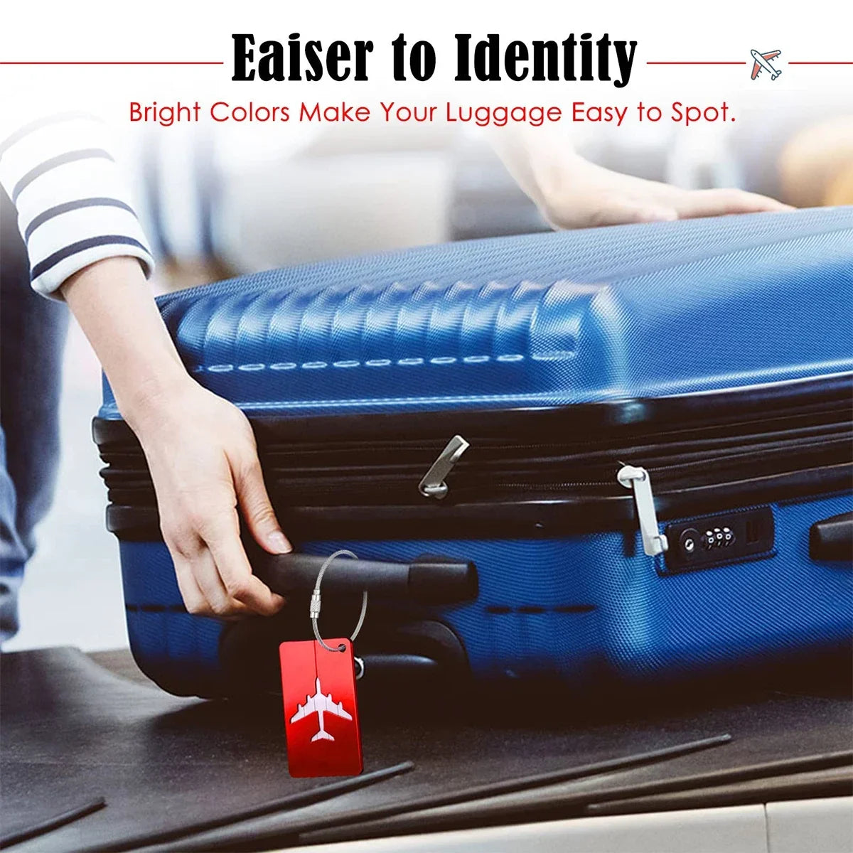 A hand is holding a red luggage tag attached to a blue aluminum suitcase.
