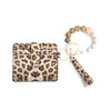 A silicone bead bracelet and a leather card holder with a tassel are displayed on a white background.