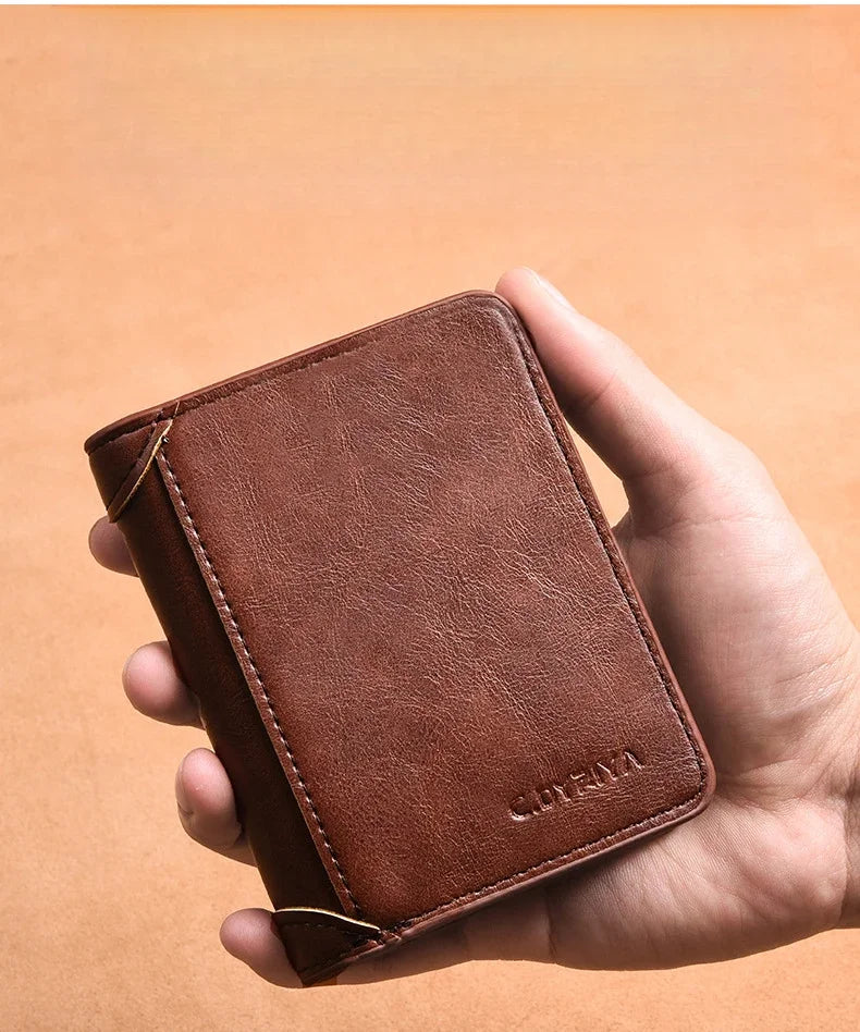 A hand holds a brown luxury PU leather men's wallet with a stitched edge against a light background.
