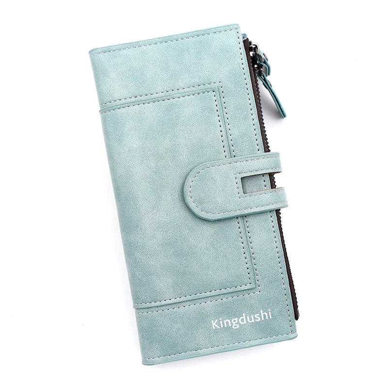 A light blue suede wallet with a flap closure and stitching, featuring the Kingdushi brand name.