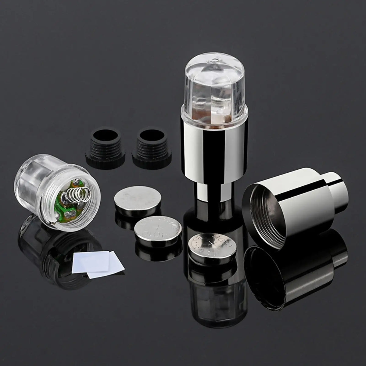 A set of two LED tire valve stem lights, including the light bulb and mounting components.