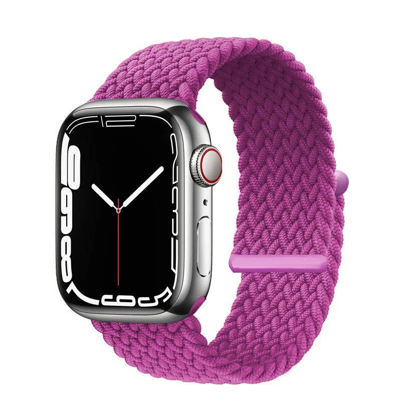 A purple braided stretch band is shown looped around a silver Apple Watch.
