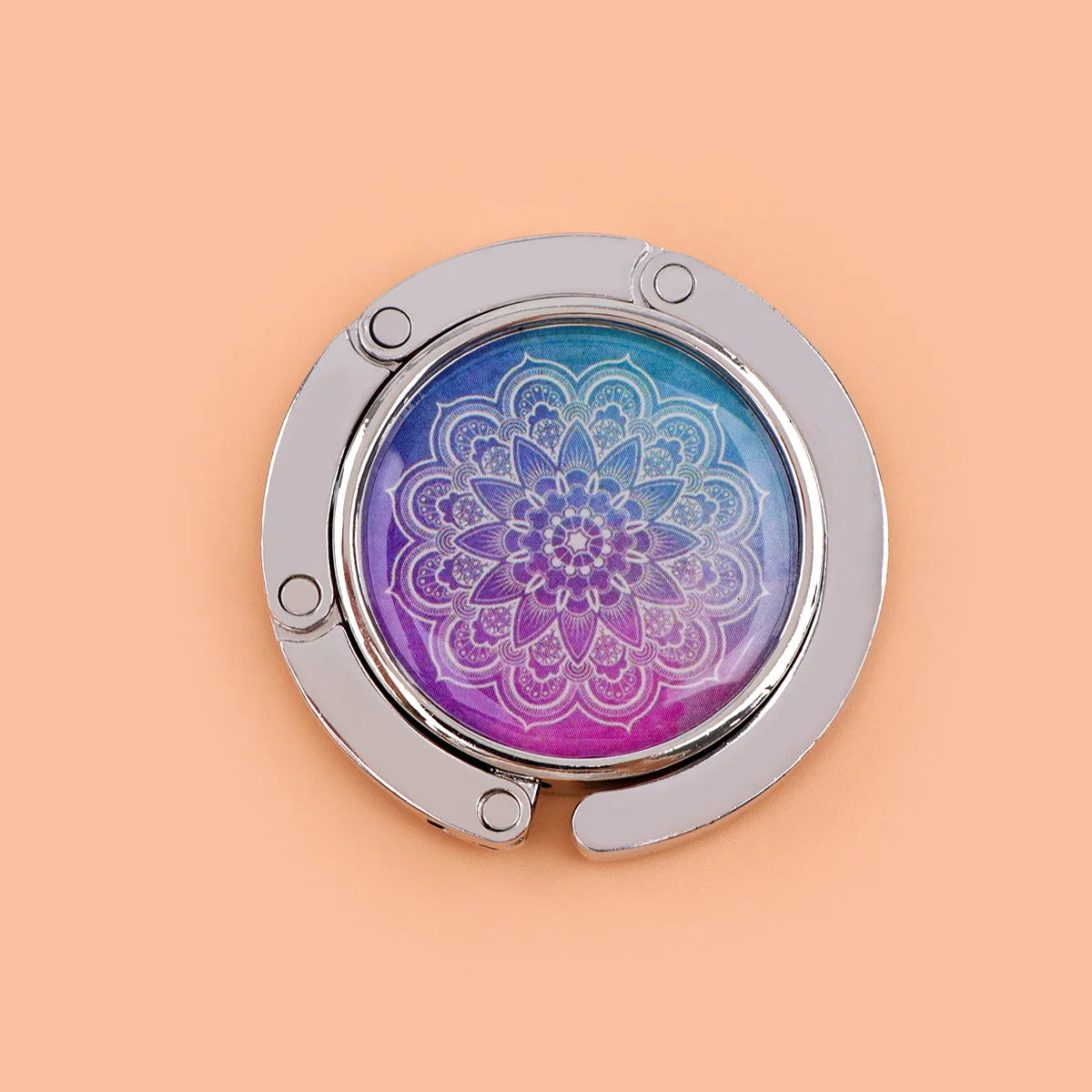 Silver folding table bag hook with a round glass featuring a purple and blue marble pattern