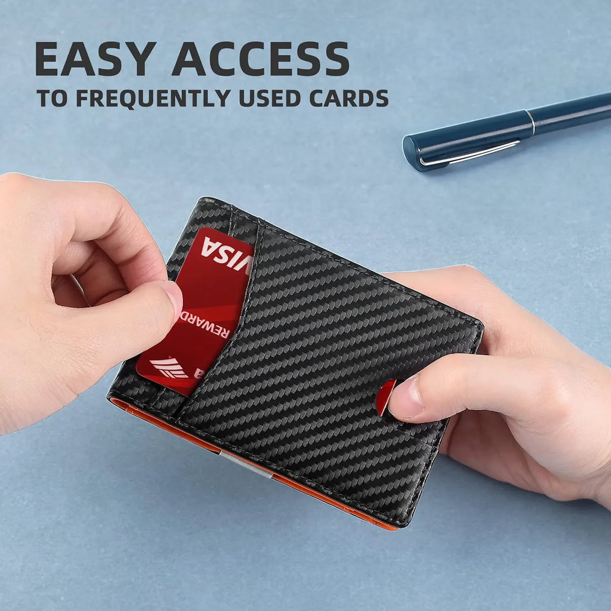 A hand holds a black patterned leather card wallet displaying a red Visa card and a credit card.