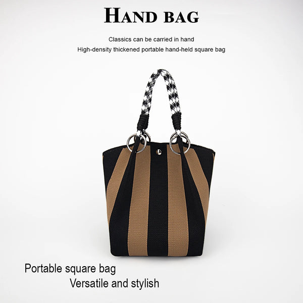 A black and tan striped square handbag with a braided strap is shown against a white background.