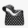 A black designer metal rivet shoulder bag with a textured surface of silver studs.