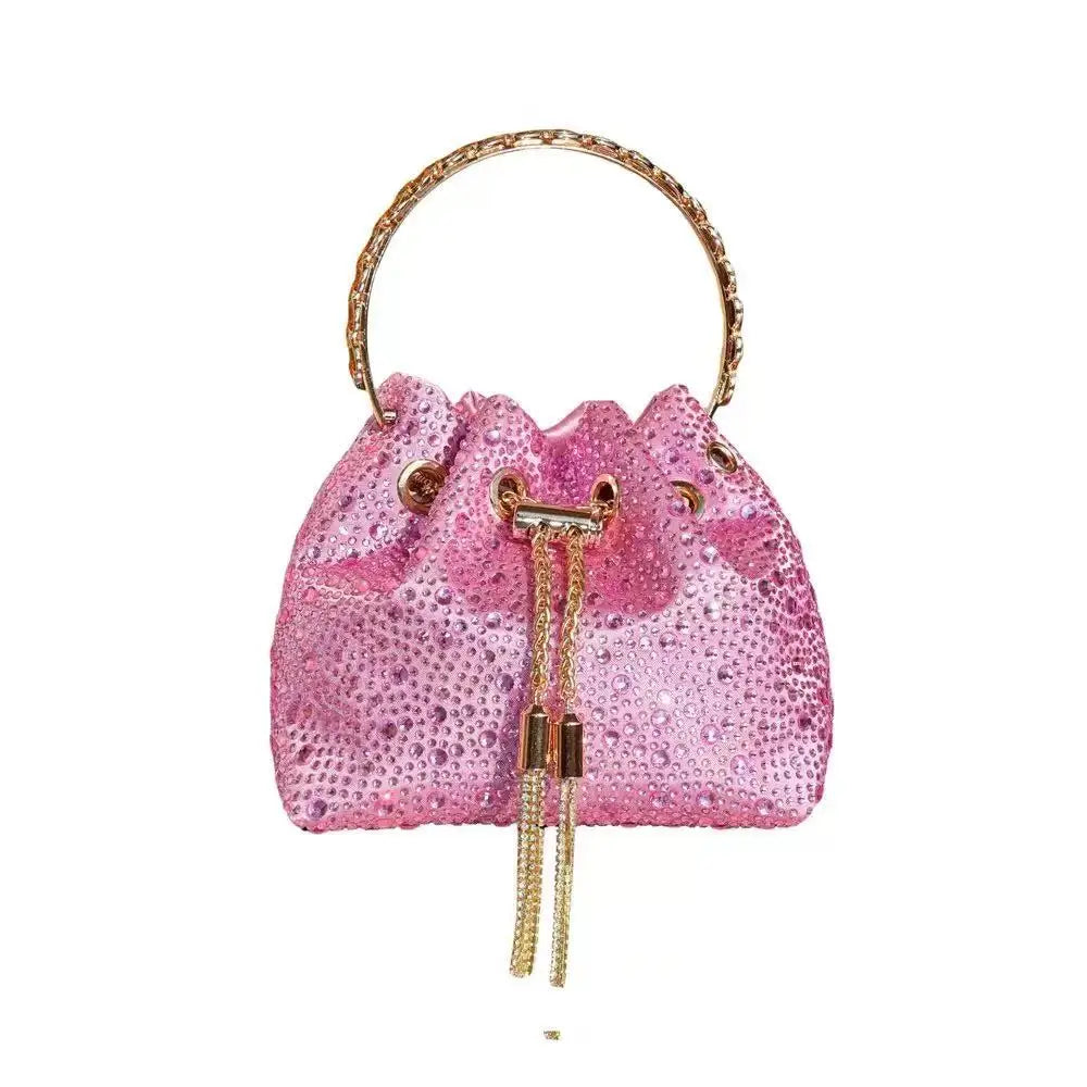 A pink crystal-embellished evening clutch bag with a gold chain strap.
