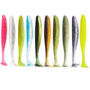 A row of colorful adjustable soft lure fishing tackle, featuring various shades of pink, green, and blue.