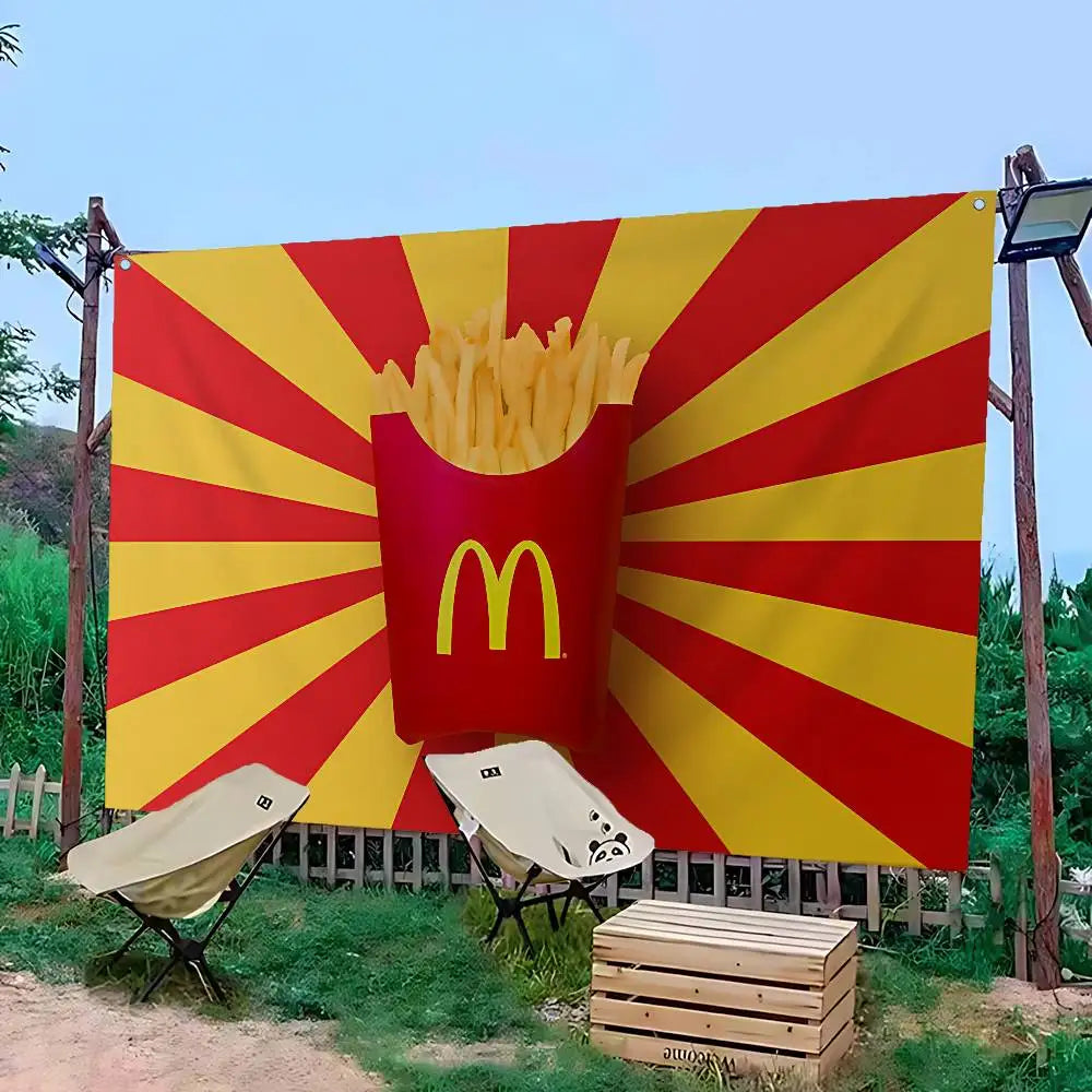 A large outdoor banner featuring the McDonald's golden arches logo radiating outward on a red and yellow background.