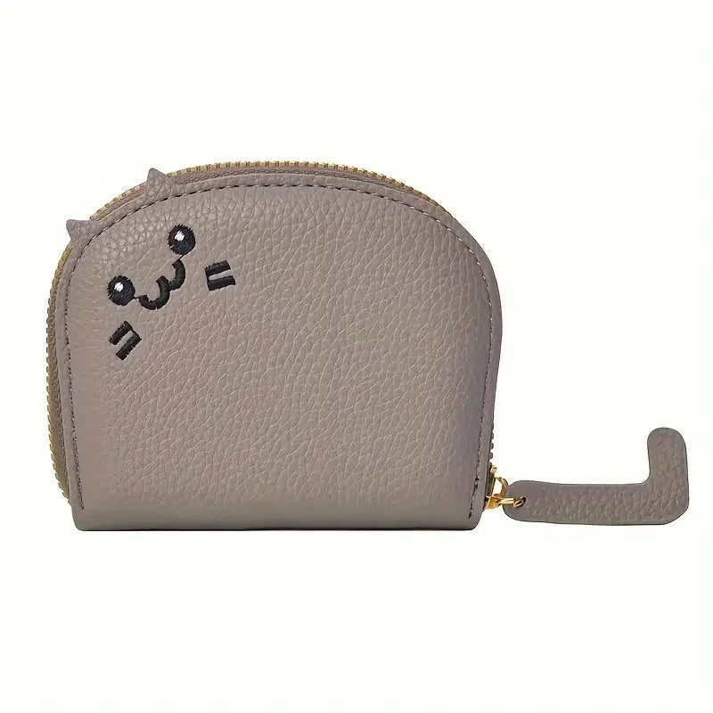 A light beige faux leather multi-card wallet with a cartoon cat face design.
