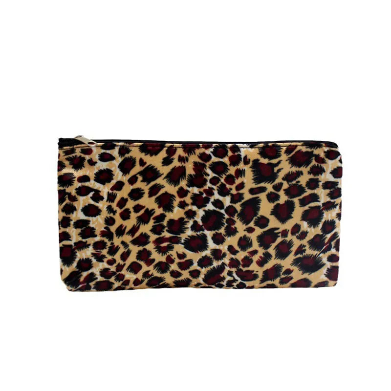 A rectangular leopard print zippered cosmetic bag in shades of brown and black.