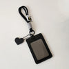 A black leather credit card and ID holder attached to a keychain with a lanyard.