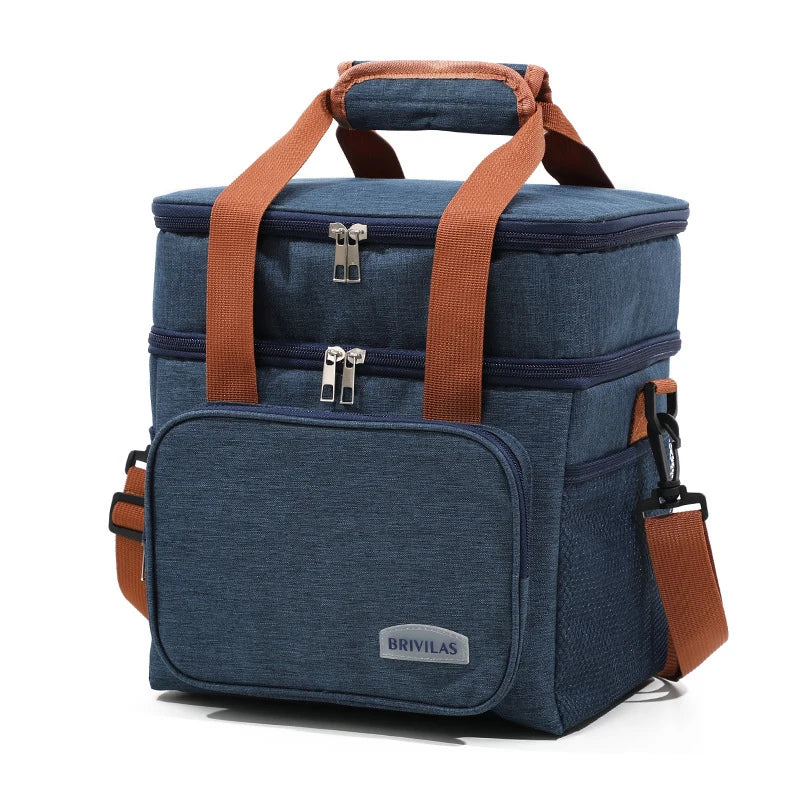 Sac de pique-nique isotherme bleu marine à double paroi avec anses et fermetures en cuir marron.