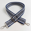 A navy blue and white patterned adjustable handbag strap with a silver buckle.