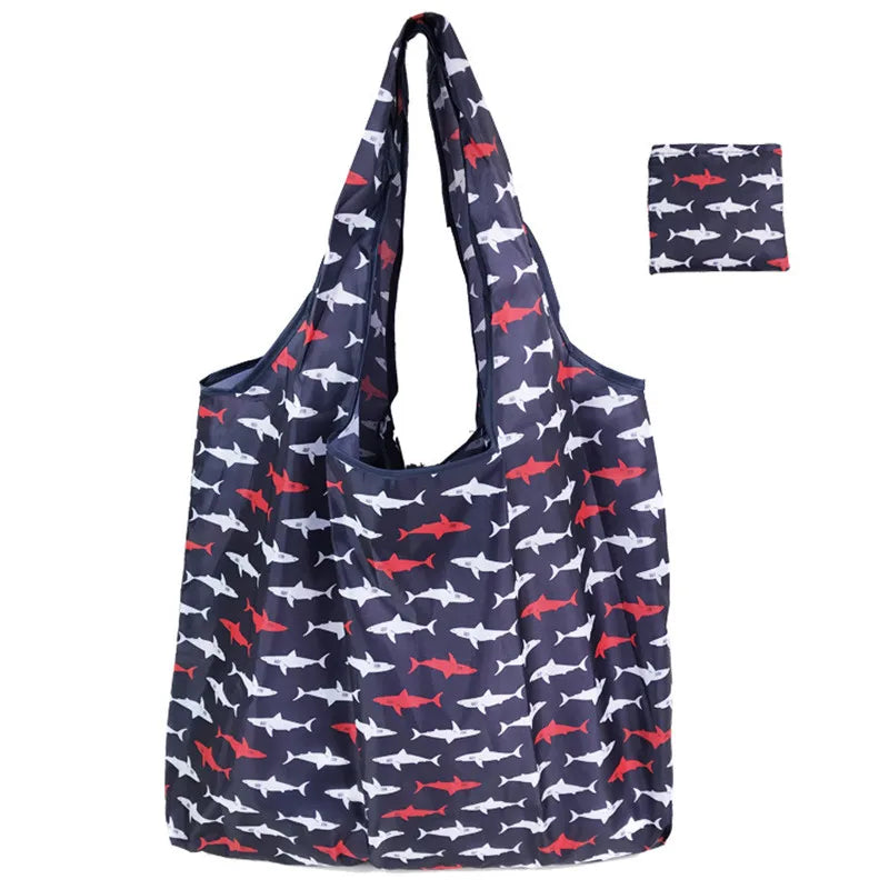 Navy blue and red patterned reusable nylon tote bag with a small fish design