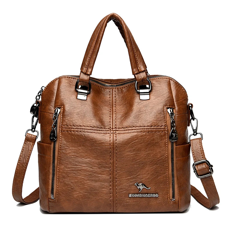 A brown leather fashion crossbody backpack bag with silver hardware.