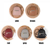 A set of five waterproof PU mini backpacks in pink, brown, red, grey, and black displayed on a wooden background.