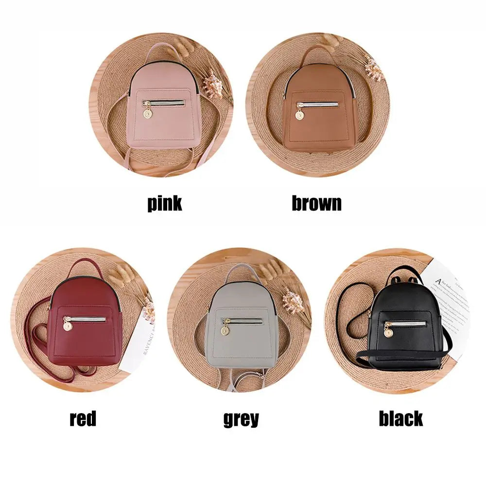 A set of five waterproof PU mini backpacks in pink, brown, red, grey, and black displayed on a wooden background.
