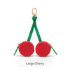 Red coin purse keychain with a large cherry design and gold-colored hardware.