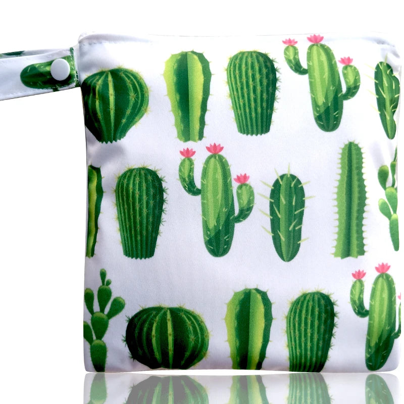 A white reusable waterproof snack bag featuring a pattern of green cacti.
