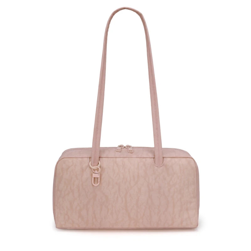 A light pink leopard print nylon shoulder tote bag with a long strap.