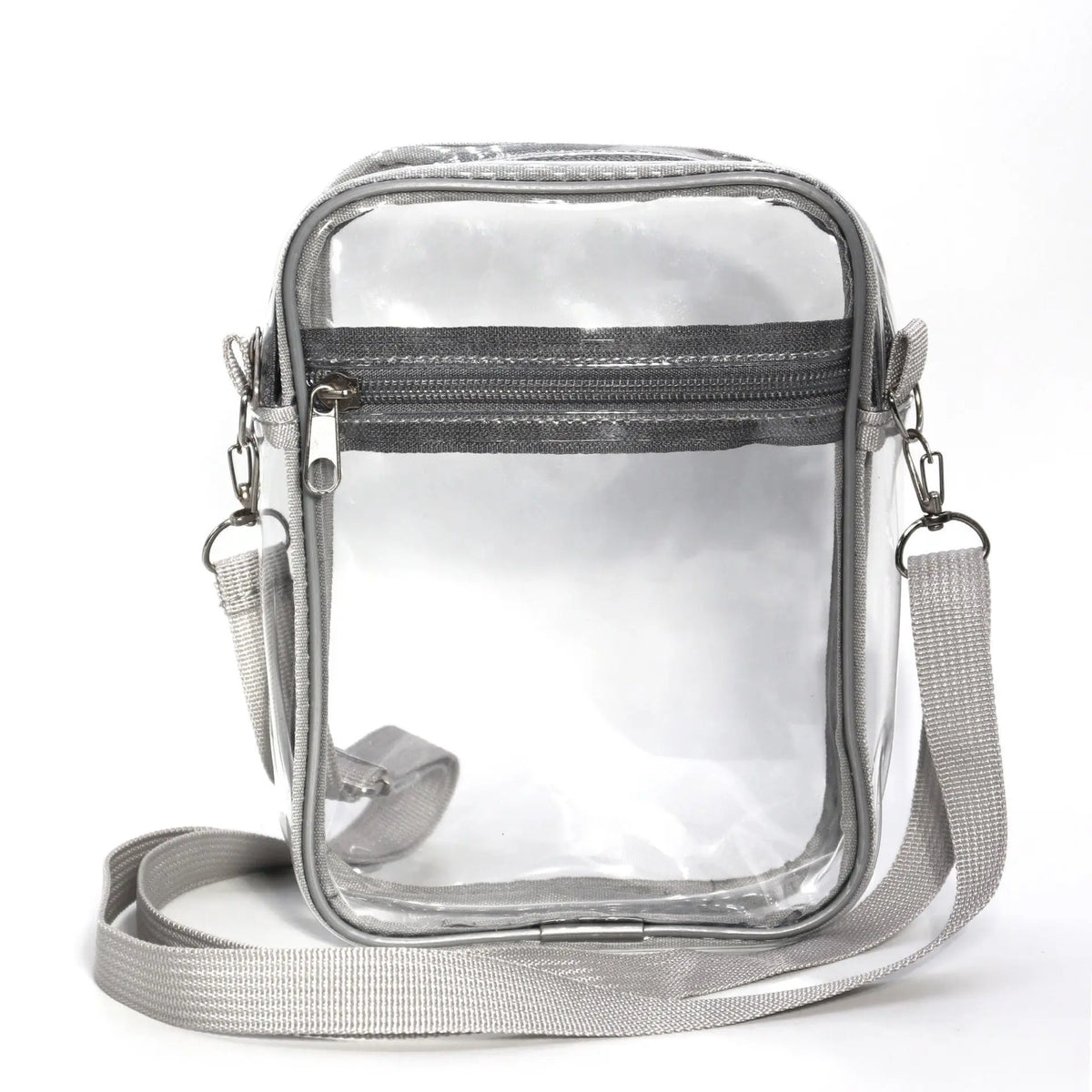 A clear transparent crossbody bag with a gray fabric and adjustable strap.
