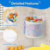 A white mesh storage caddy with four internal pockets filled with small toys and accessories